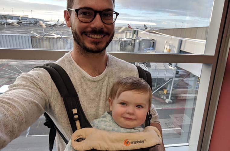 baby in baby carrier at airport